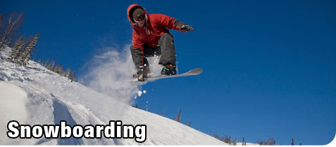 Young Man Snowboarding on a Mountain