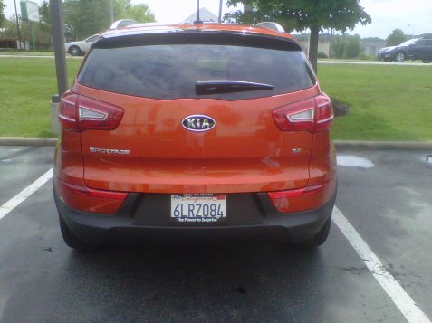 2011 Kia Sportage metallic orange rear view